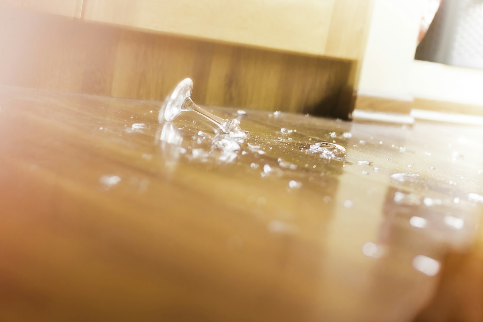 Water spreading across a wooden surface